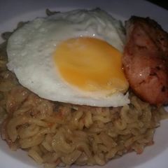 A picture of Noodles Sunny Side Up and Grilled Chicken.