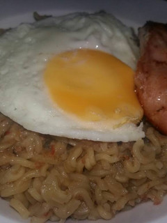 A picture of Noodles Sunny Side Up and Grilled Chicken.