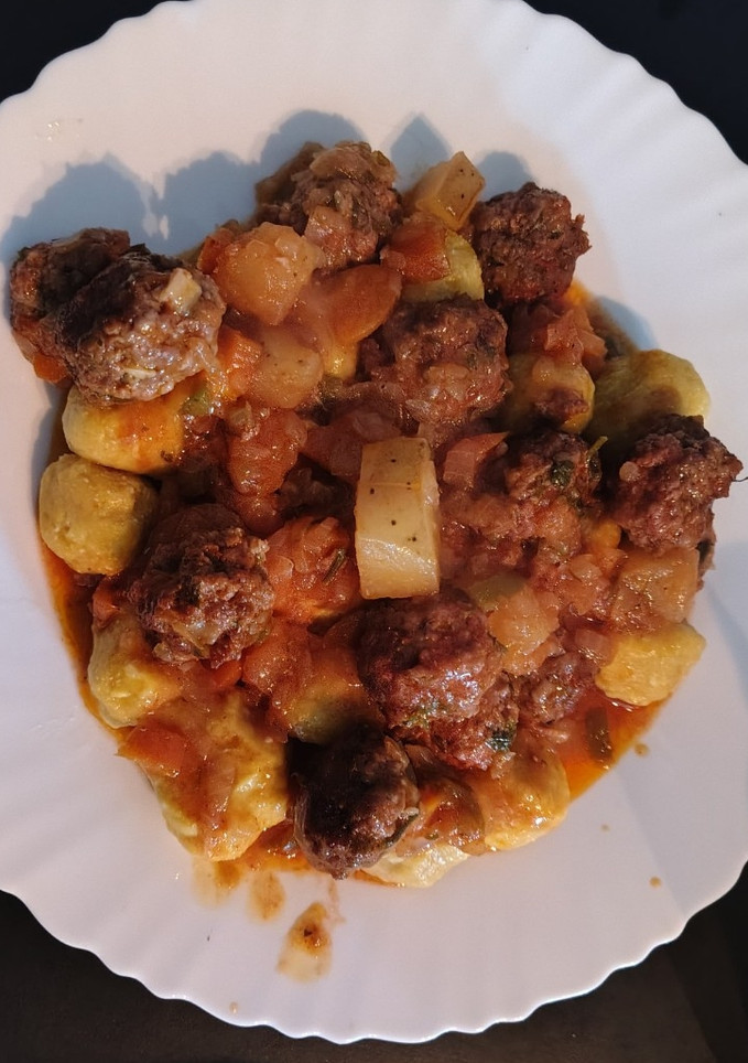 Una foto de Malfattis de zapallo con albóndigas