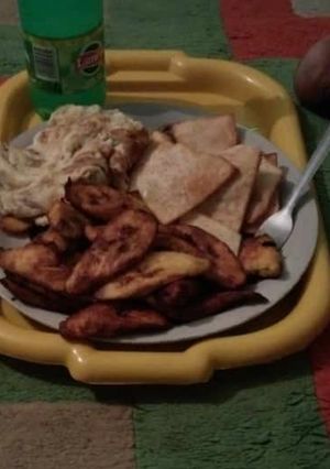 A picture of Fried yam,plantain and egg.