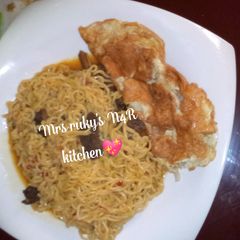 Indomie noodles with fry eggs A picture of Indomie noodles with fry eggs.