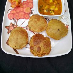 A picture of Puri aloo tmatar sbji.