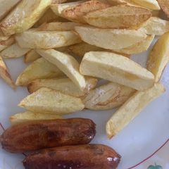 A picture of Chips and sausage#staplefoodrecipecontest.
