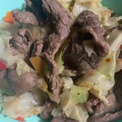 A picture of Seductive Sizzle Beef with Caramelized Cabbage and Peppers.