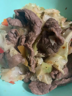A picture of Seductive Sizzle Beef with Caramelized Cabbage and Peppers.