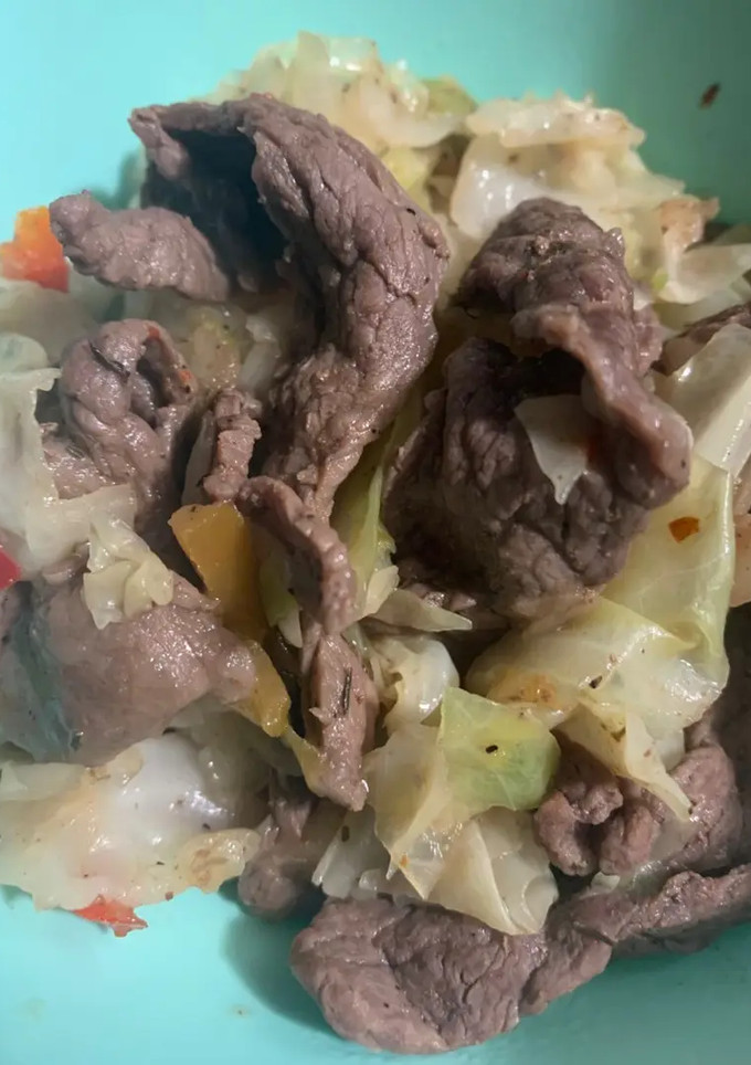A picture of Seductive Sizzle Beef with Caramelized Cabbage and Peppers.
