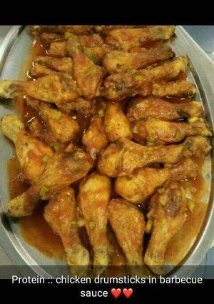 A picture of Chicken drumsticks in barbecue sauce.