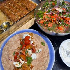 A picture of Tray Bake Beef Kebab with Tomato Salad.