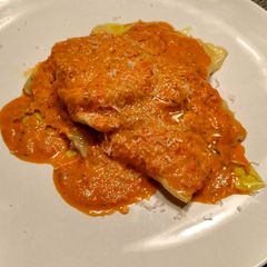 A picture of Goat Cheese Pancetta Ravioli with a Spicy Citrus Sauce.