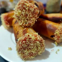 A picture of Rotli cigars using leftover farsan after Diwali.