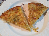 Pizza de cebolla y quesos