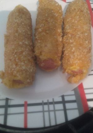 Una foto de Salchichas envueltas en fiambre y apanadas!