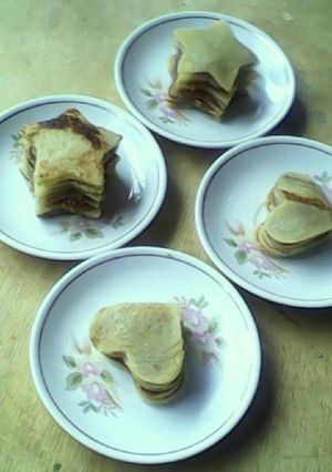 Una foto de Panqueques baby, con miel, coco y dulce de leche
