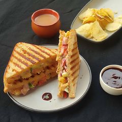 A picture of Grilled Sandwich With Thousand Island Dressing.