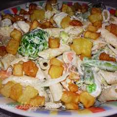 A picture of Pasta with mayonnaise and veggies.