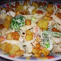 A picture of Pasta with mayonnaise and veggies.