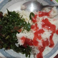 A picture of Rice sukuma and sauce.