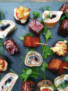 A picture of Smoked salmon and caviar pancake canapés.