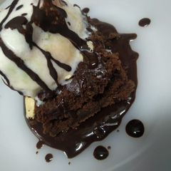 A picture of Chocolate brownie with ice cream.