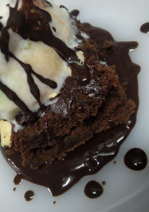 A picture of Chocolate brownie with ice cream.