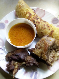 A picture of Deep fried duck served with soup and chapati.