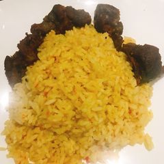 A picture of Curry rice and fried beef.
