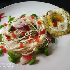 A picture of Boiled noodles with egg poach.