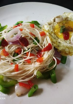 A picture of Boiled noodles with egg poach.