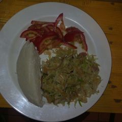 A picture of Ugali with steamed cabbage.