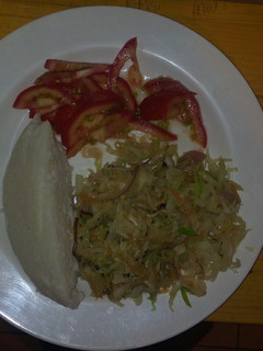 A picture of Ugali with steamed cabbage.
