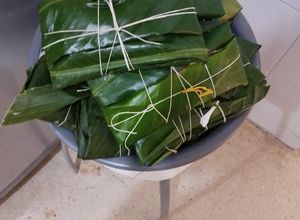 Una foto de Tamales o pasteles de cerdo y pollo