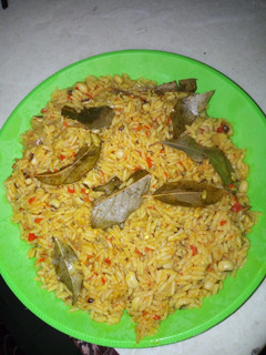 A picture of Jollof rice and beans.