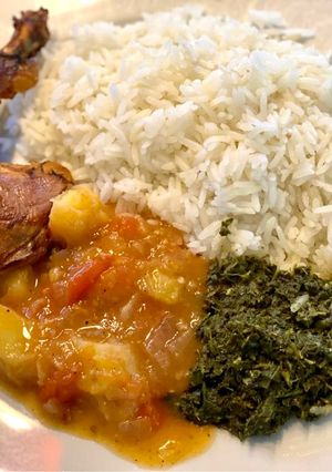 A picture of Cassava leaves (Kisamvu) and potato & tomato sauce.