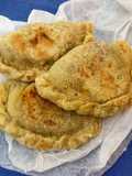 Empanadas di farro con indivia riccia e quartirolo