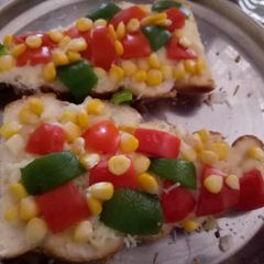 Garlic bread with toppings A picture of Garlic bread with toppings.