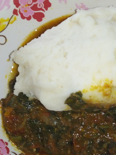 A picture of Pounded yam & ugu leave.