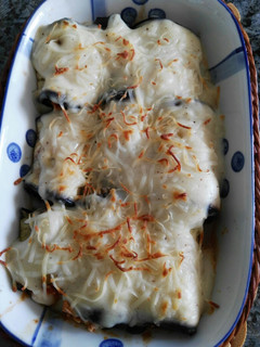 Una foto de Canelones vegetarianos de berenjena y tofu