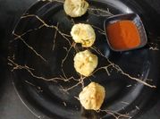 A picture of corn cheese momos
