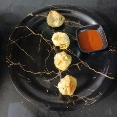 A picture of Corn-Spinach Momos.