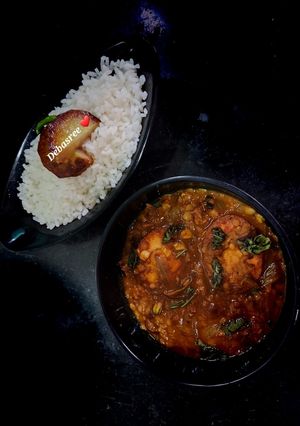 A picture of Lentil fry with boiled egg.