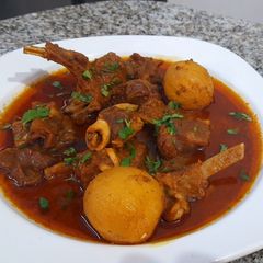 A picture of Mutton Curry With Whole Potatoes.