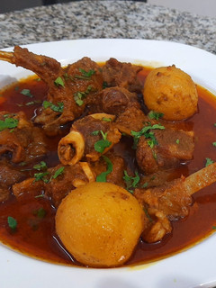 A picture of Mutton Curry With Whole Potatoes.