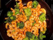 A picture of stirfry shrimp and brocolli