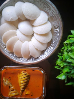 A picture of South Indian manglore fish curry and Idli.