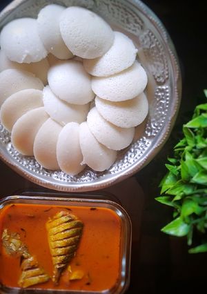 A picture of South Indian manglore fish curry and Idli.