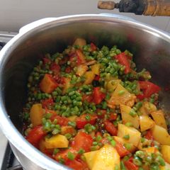 A picture of Aloo chorifali and tomato sabji.