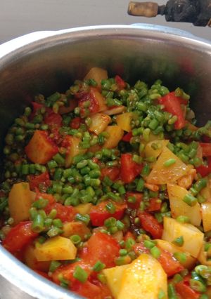 A picture of Aloo chorifali and tomato sabji.