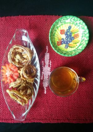 A picture of Fried rings with green tea.