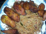 A picture of spaghetti with fried plantain