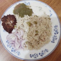 A picture of Matar Pulao with Chapli Kabab.